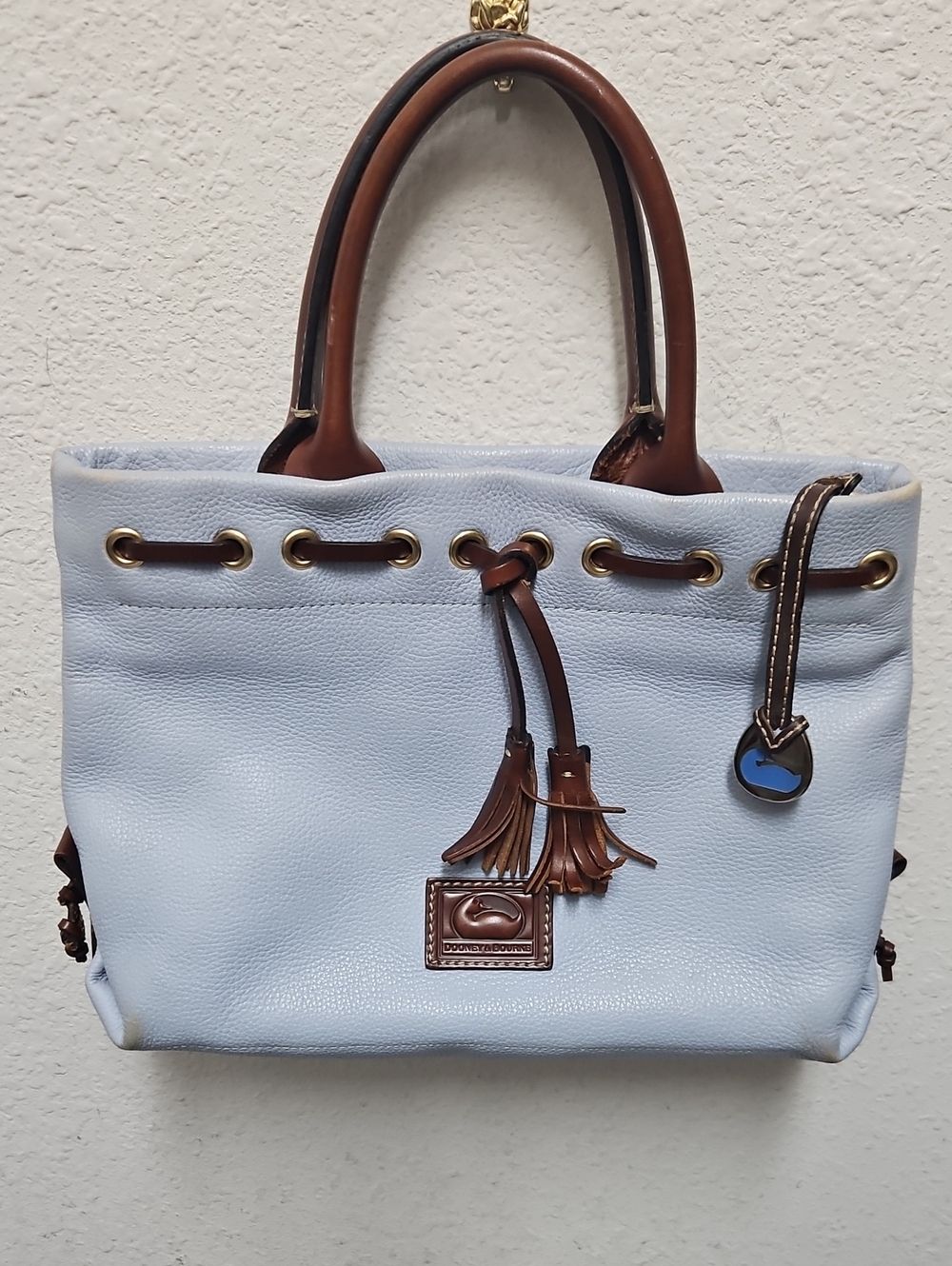 Dooney & Bourke Light Blue Leather Tote with Brown Trim and Tassel Charm